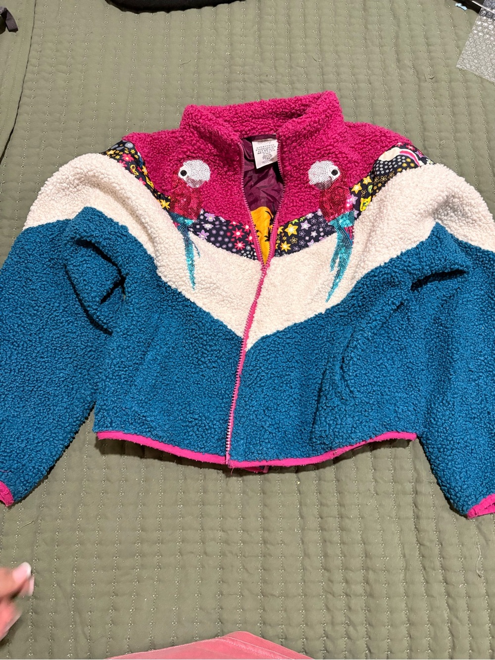 Disney Colorblock Encanto Sherpa Jacket in Pink, Teal & Cream with Parrot Motif